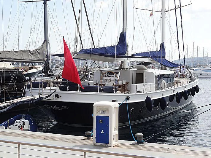 a boat docked at a pier aboard TUYIKA S Yacht for Sale