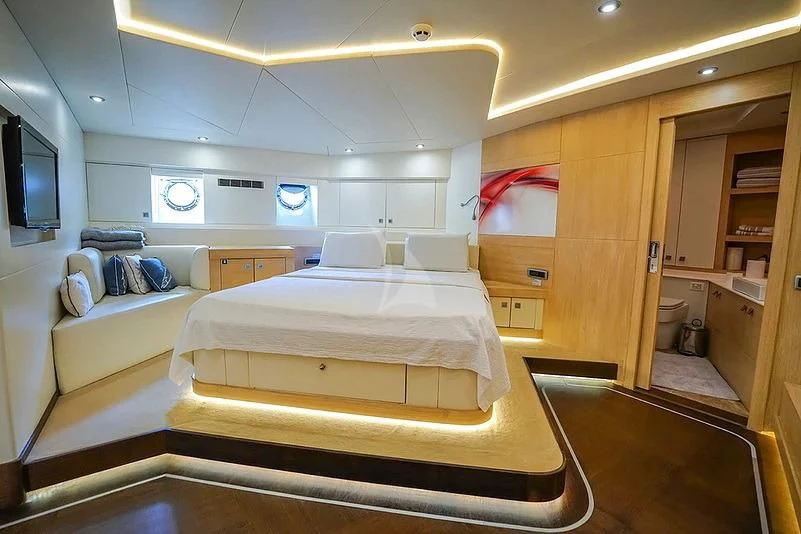 a room with a bed and a tv aboard TUYIKA S Yacht for Sale