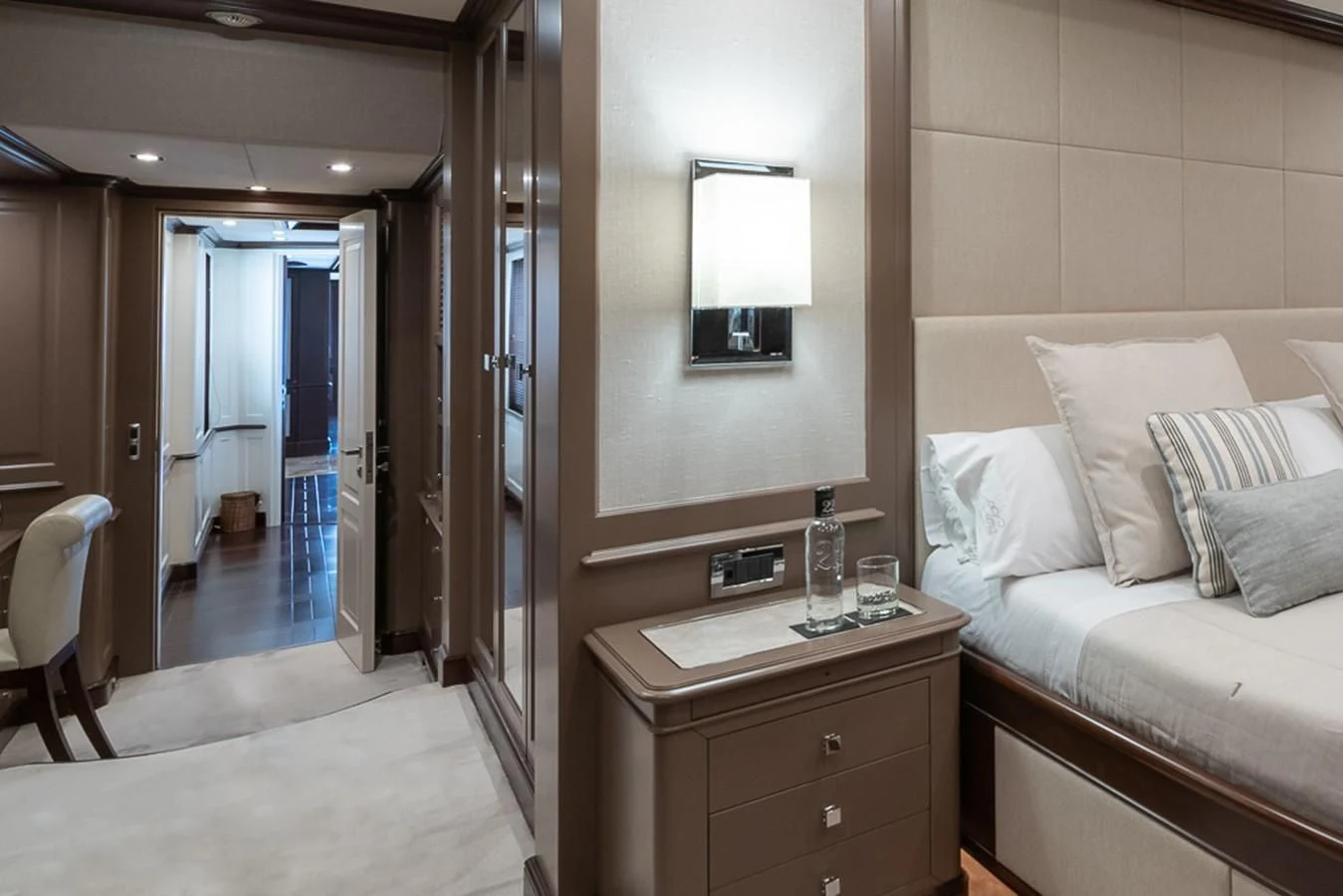 a room with a bed and a desk aboard ELENA NUEVE Yacht for Charter