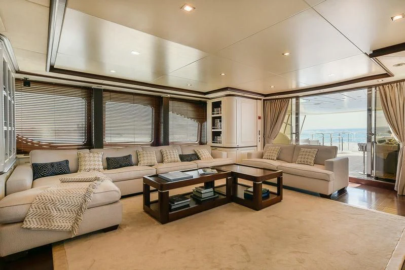 a living room with a large window aboard ELENA NUEVE Yacht for Charter