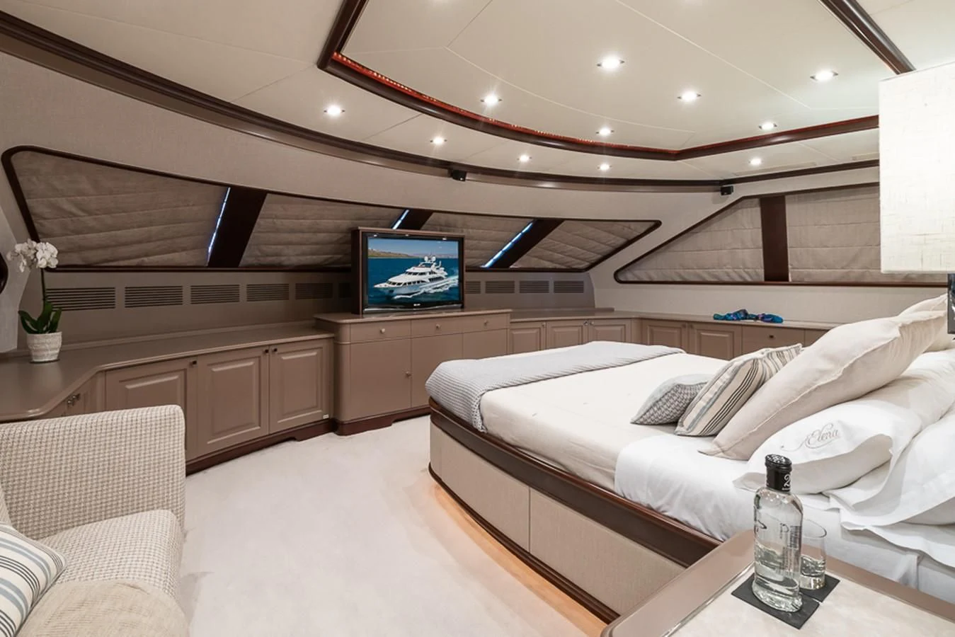 a room with a bed and a tv aboard ELENA NUEVE Yacht for Charter