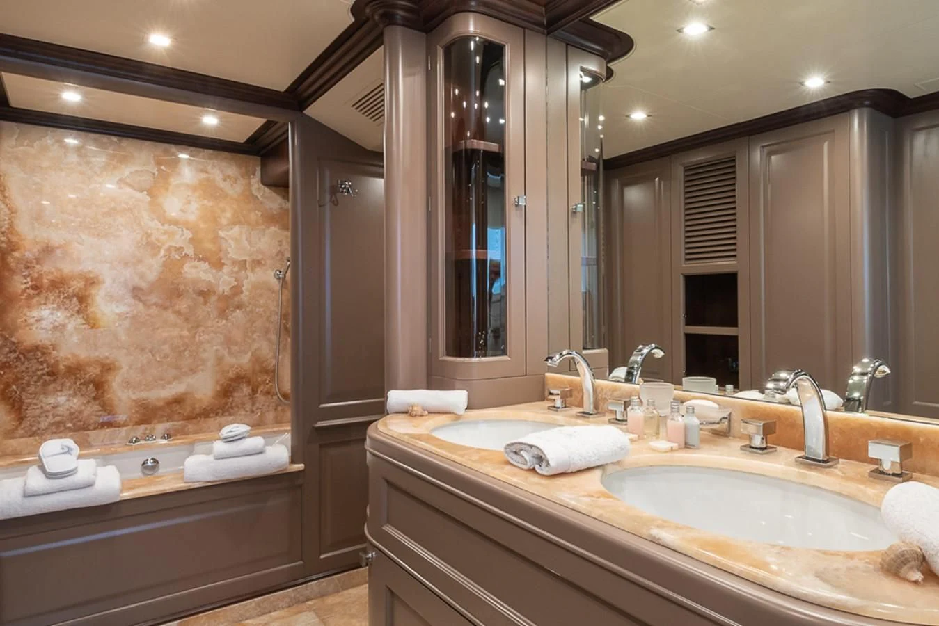 a bathroom with a large mirror aboard ELENA NUEVE Yacht for Charter