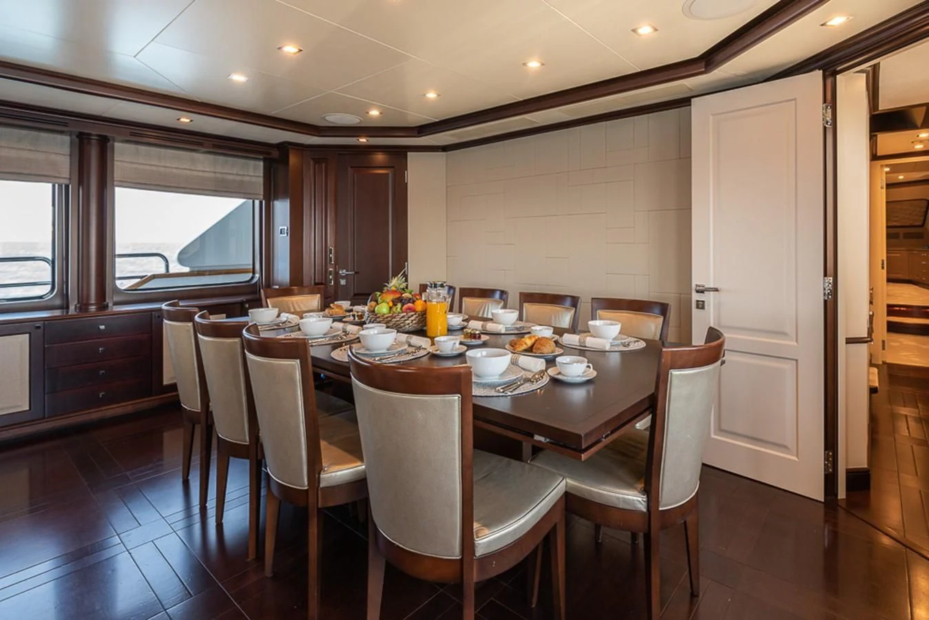 a dining table set for a meal aboard ELENA NUEVE Yacht for Charter