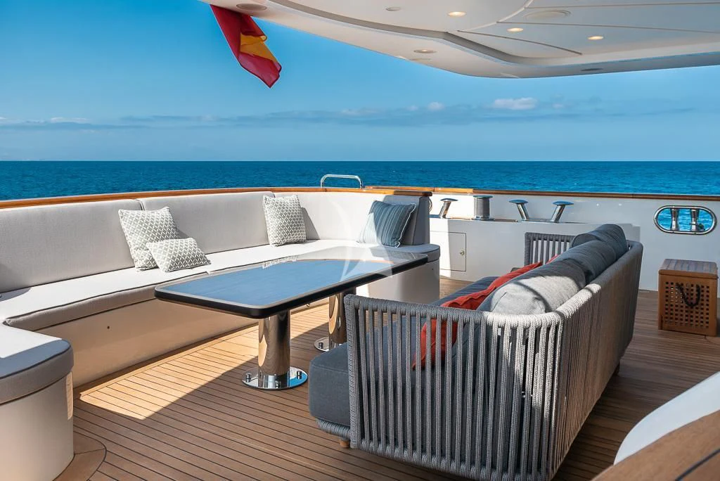 a room with a table and chairs aboard ELENA NUEVE Yacht for Charter
