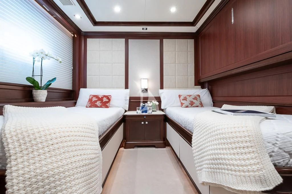 a room with two beds aboard ELENA NUEVE Yacht for Charter