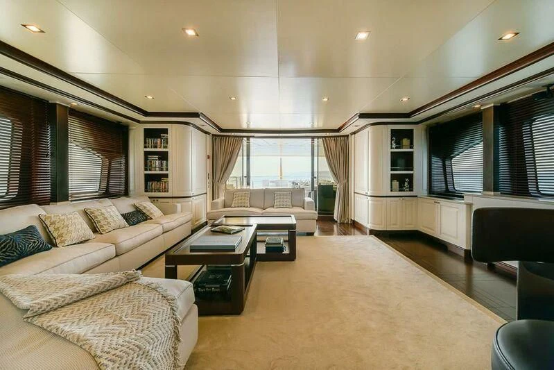 a living room with a couch and a coffee table aboard ELENA NUEVE Yacht for Charter
