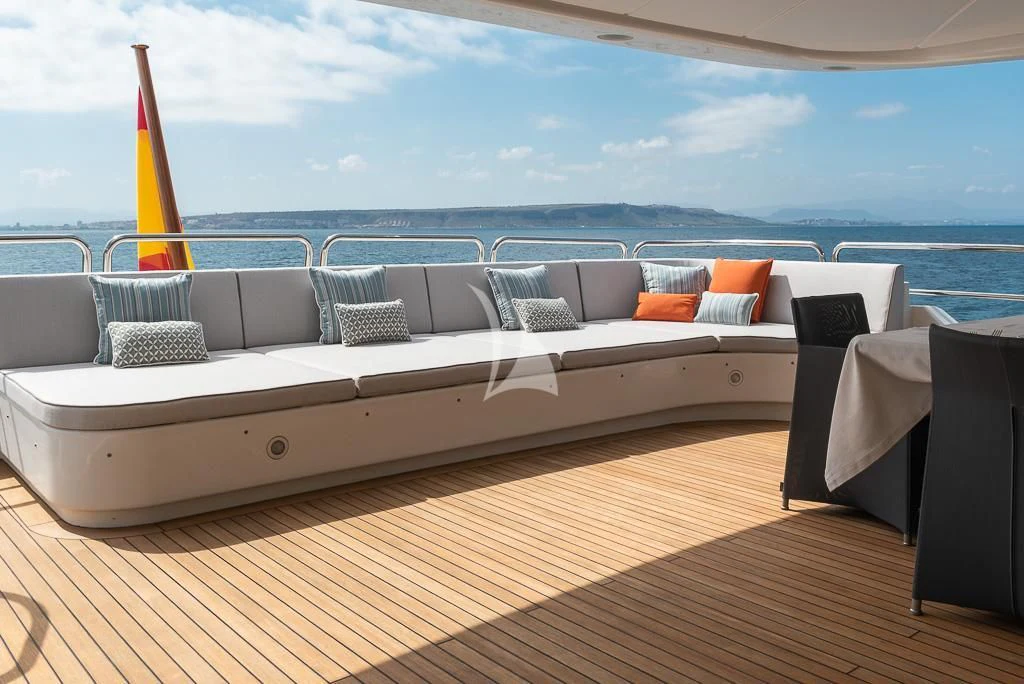 a large white bed on a deck aboard ELENA NUEVE Yacht for Charter