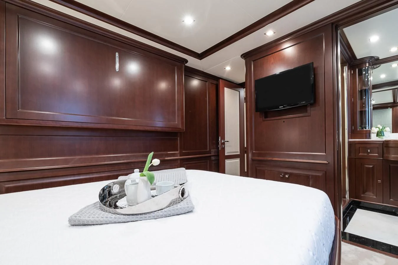 a white table with a plant on it aboard ELENA NUEVE Yacht for Charter