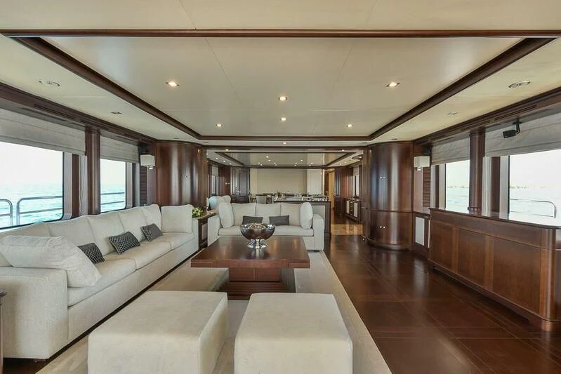 a living room with a wood floor aboard ELENA NUEVE Yacht for Charter