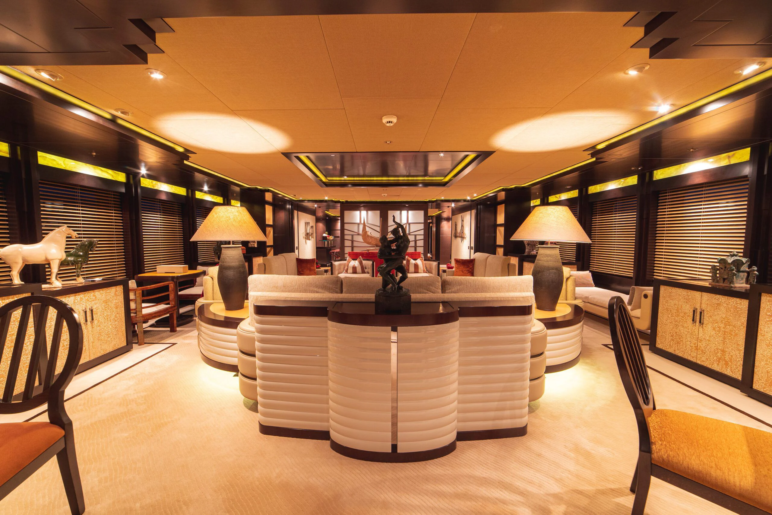 a room with a table and chairs aboard TRIDENT Yacht for Charter