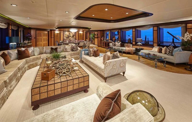 a living room with a large screen aboard TRIDENT Yacht for Charter