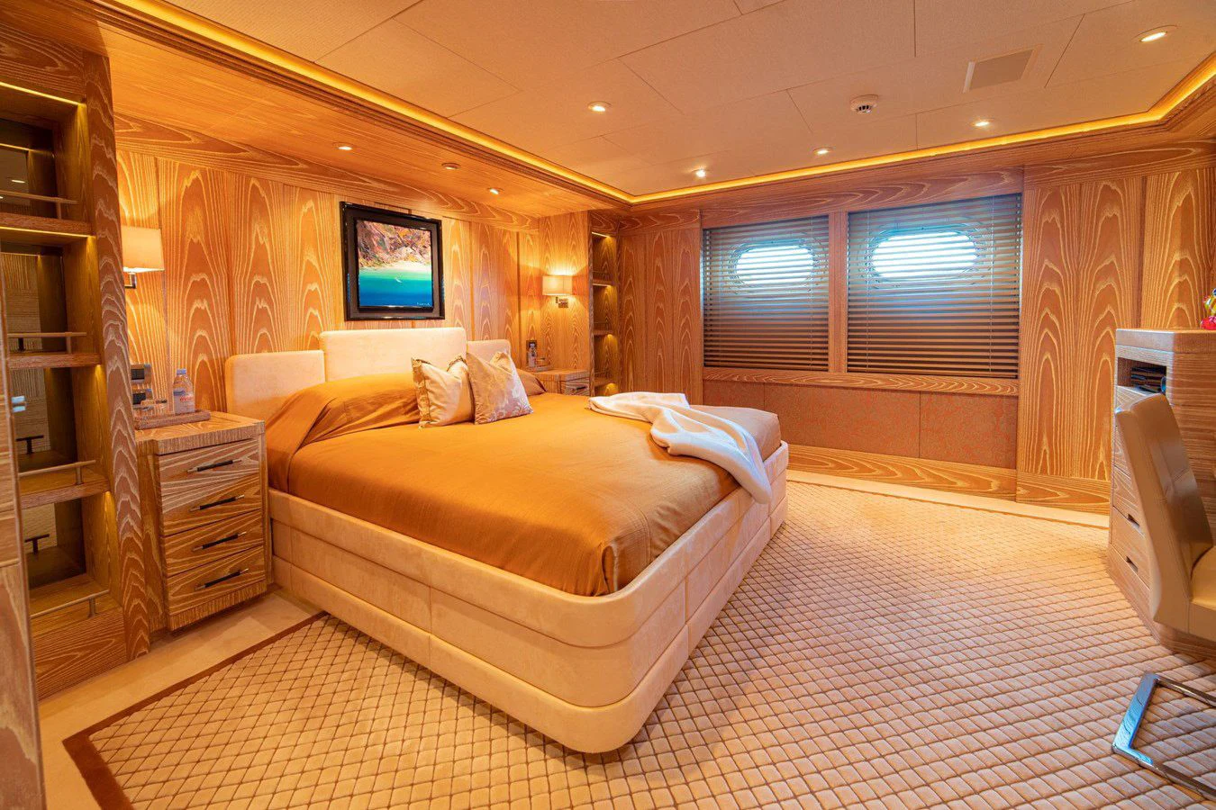 a large bedroom with a bed aboard TRIDENT Yacht for Charter