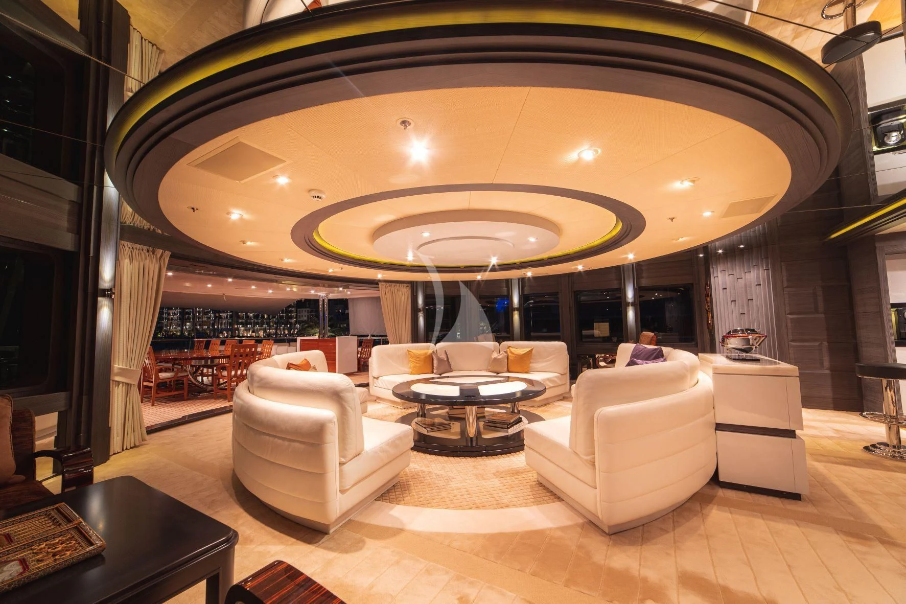 a room with a large chandelier aboard TRIDENT Yacht for Charter