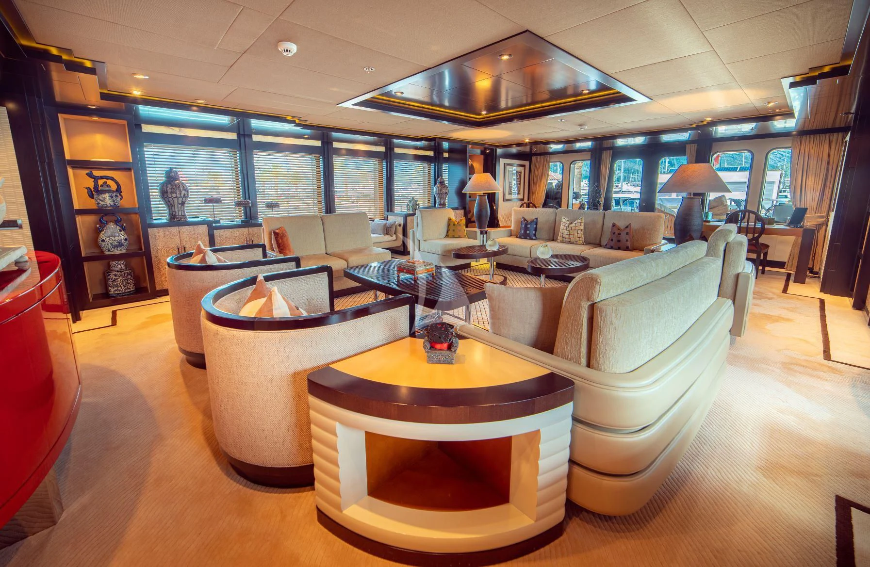 a living room with a large sofa aboard TRIDENT Yacht for Charter