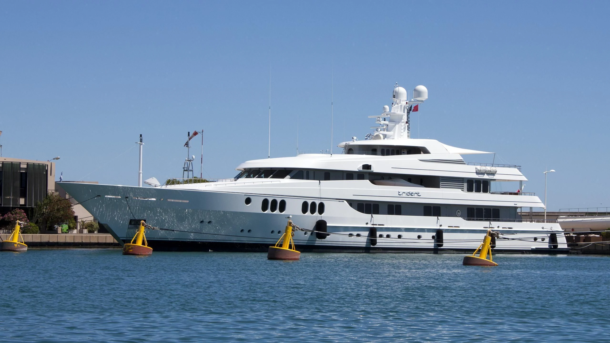 a large white ship in the water aboard TRIDENT Yacht for Charter