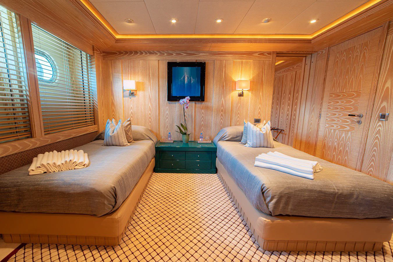 a room with two beds aboard TRIDENT Yacht for Charter