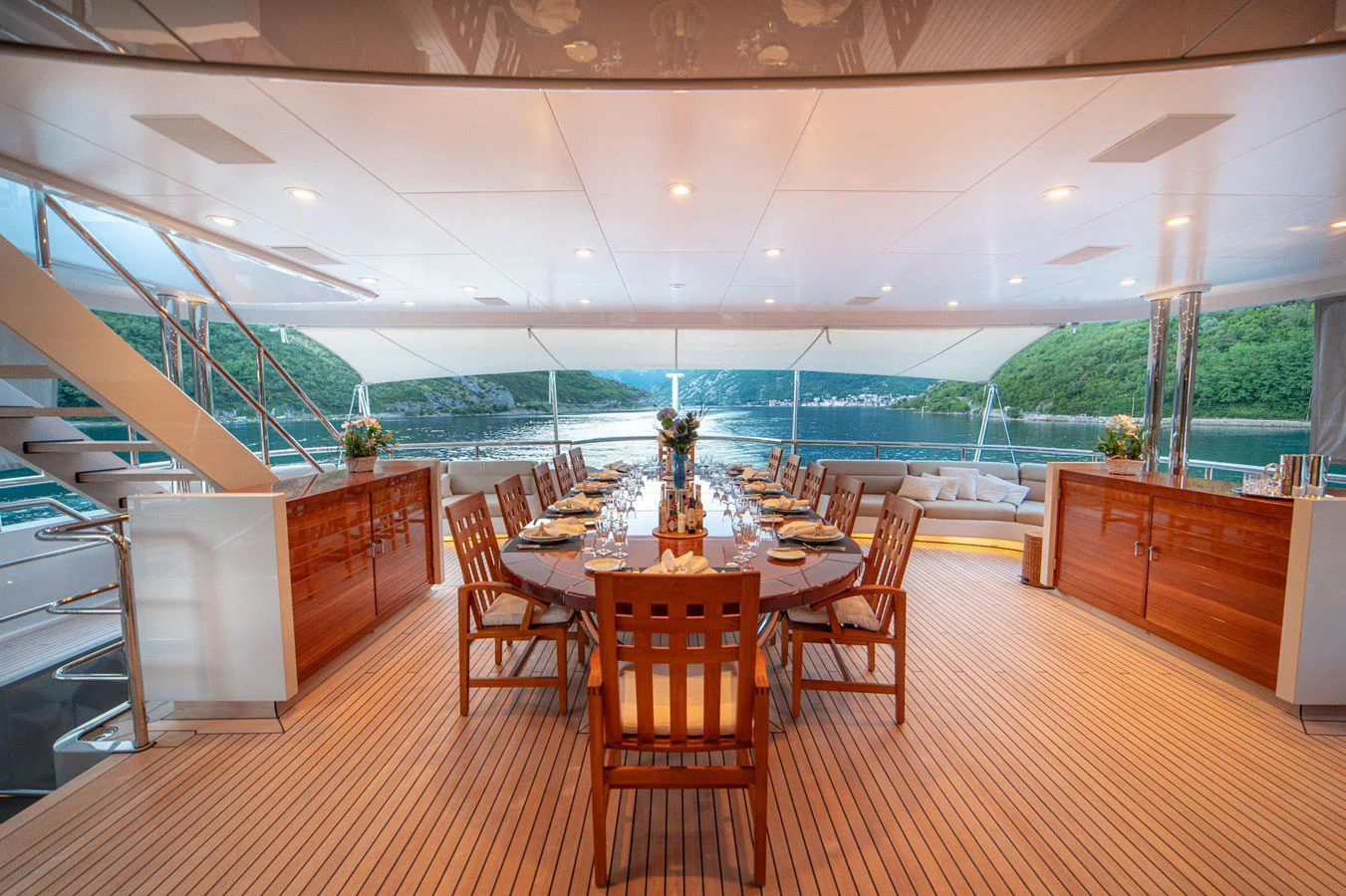 a large room with a table and chairs aboard TRIDENT Yacht for Charter