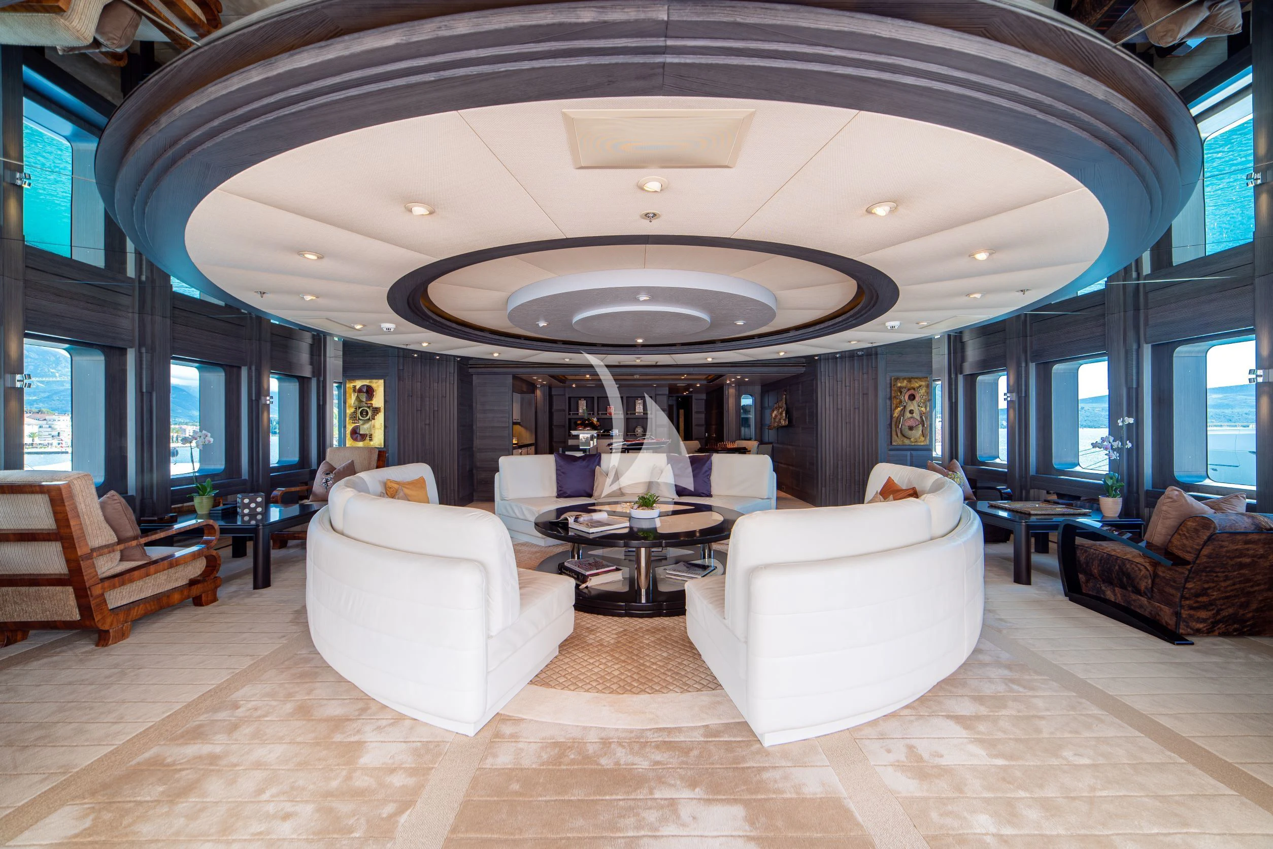 a large living room with a round ceiling aboard TRIDENT Yacht for Charter
