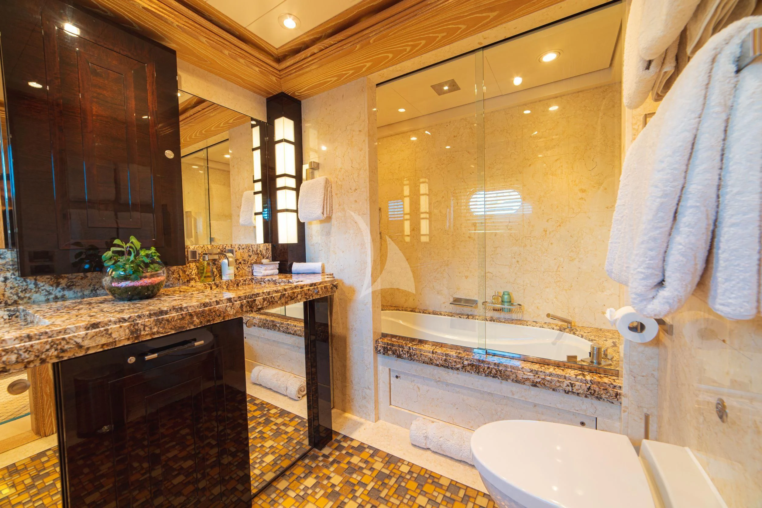 a bathroom with a large marble countertop aboard TRIDENT Yacht for Charter