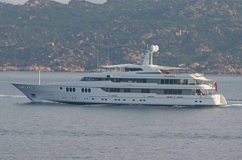 a large white boat in the water aboard TRIDENT Yacht for Charter