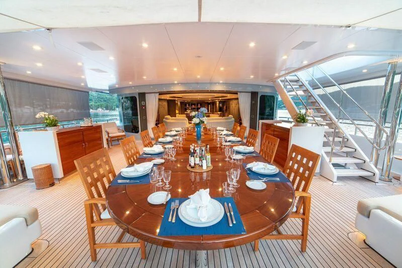 a dining room with a table and chairs aboard TRIDENT Yacht for Charter