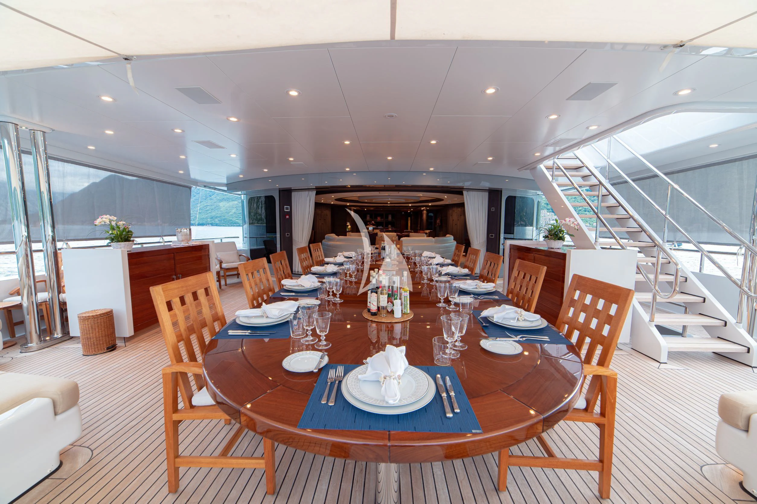 a dining room with a table set aboard TRIDENT Yacht for Charter