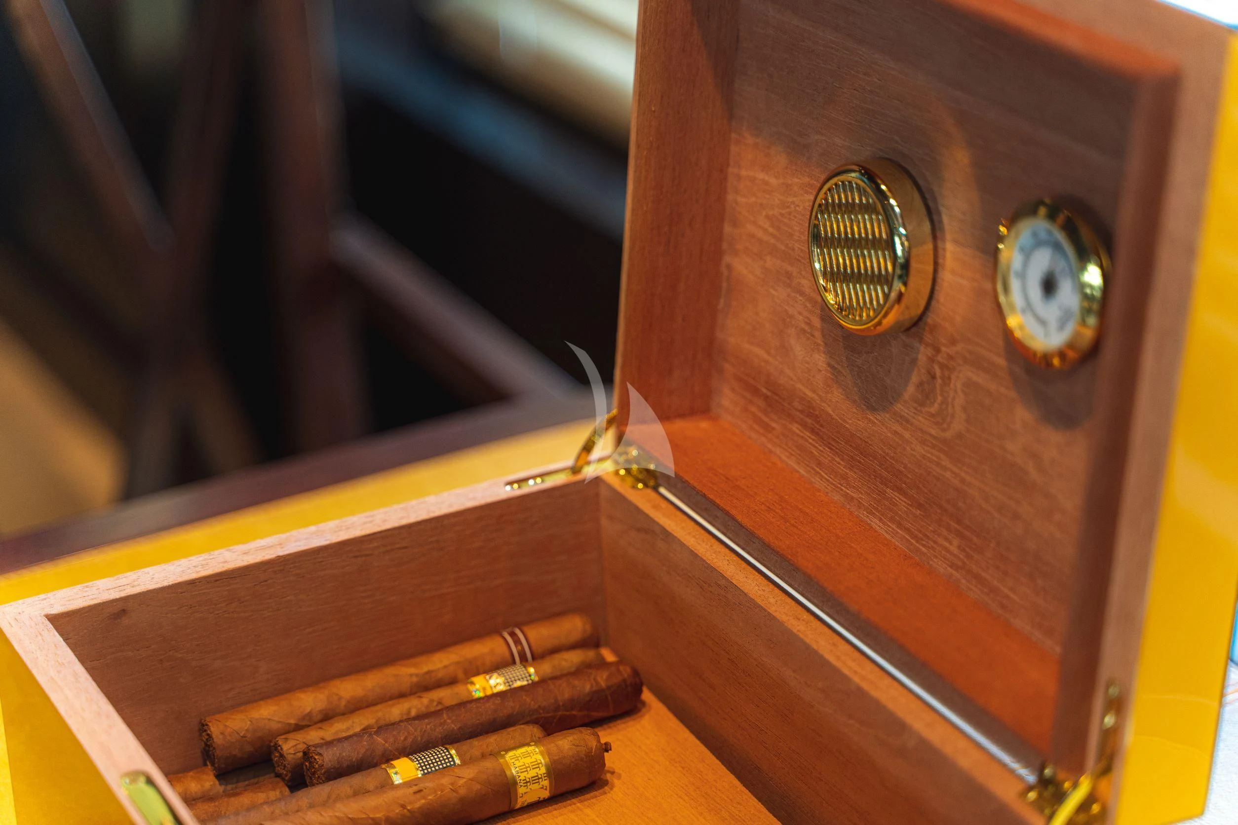 a clock on a wooden shelf aboard TRIDENT Yacht for Charter