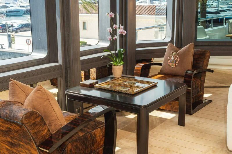 a table with a book on it aboard TRIDENT Yacht for Charter
