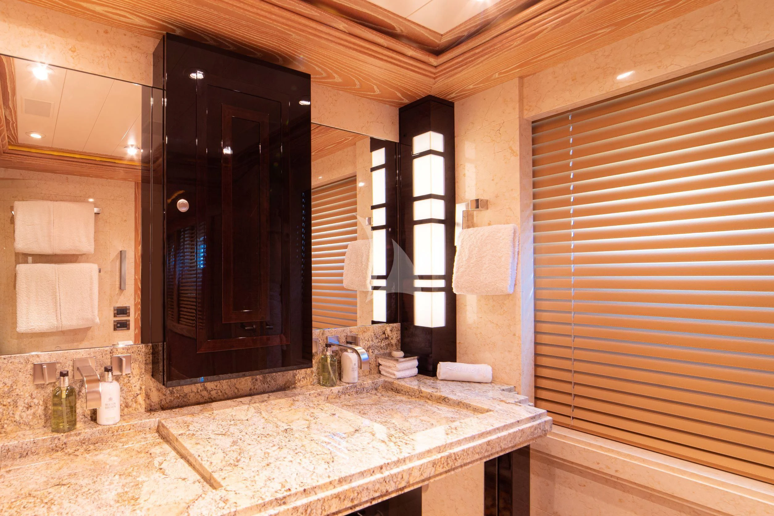 a bathroom with a large mirror aboard TRIDENT Yacht for Charter
