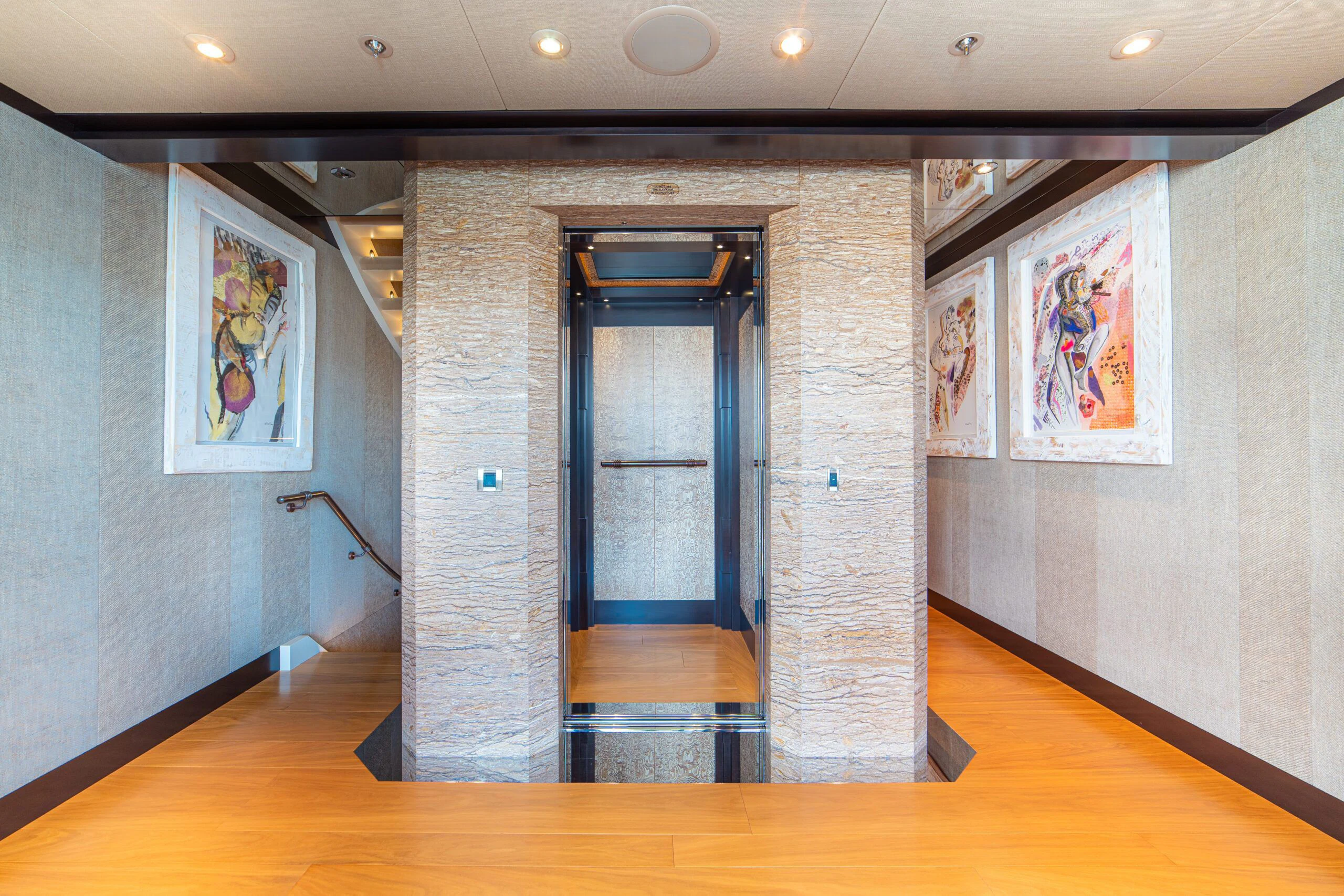 a room with a door and a mirror aboard TRIDENT Yacht for Charter