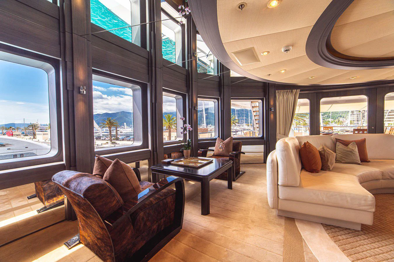 a living room with a large window aboard TRIDENT Yacht for Charter
