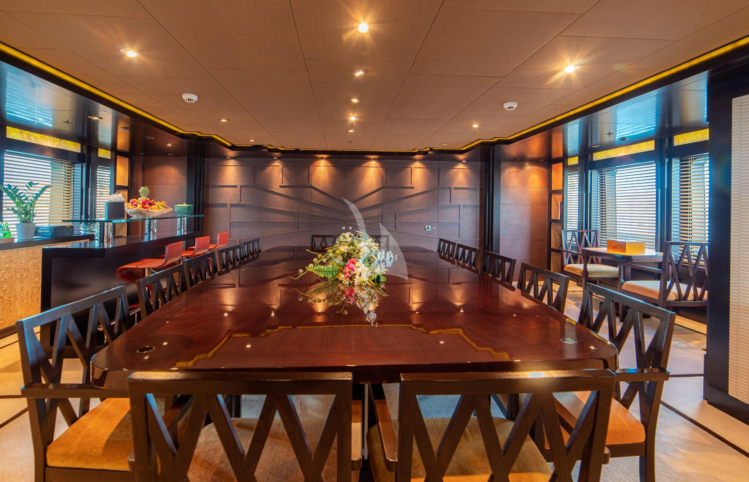 a large room with tables and chairs aboard TRIDENT Yacht for Charter