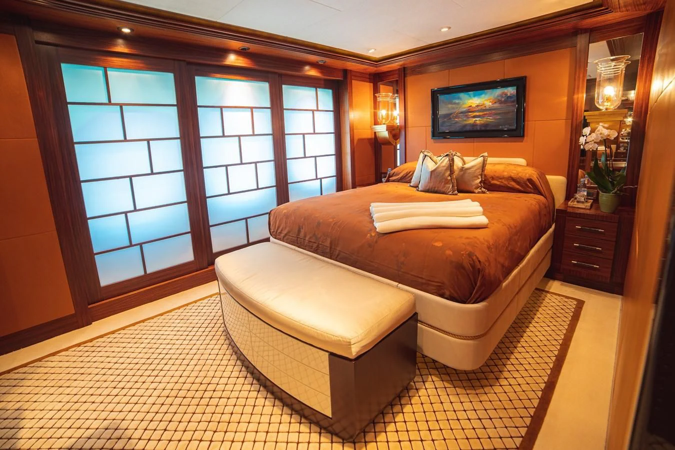 a large bed in a room aboard TRIDENT Yacht for Charter