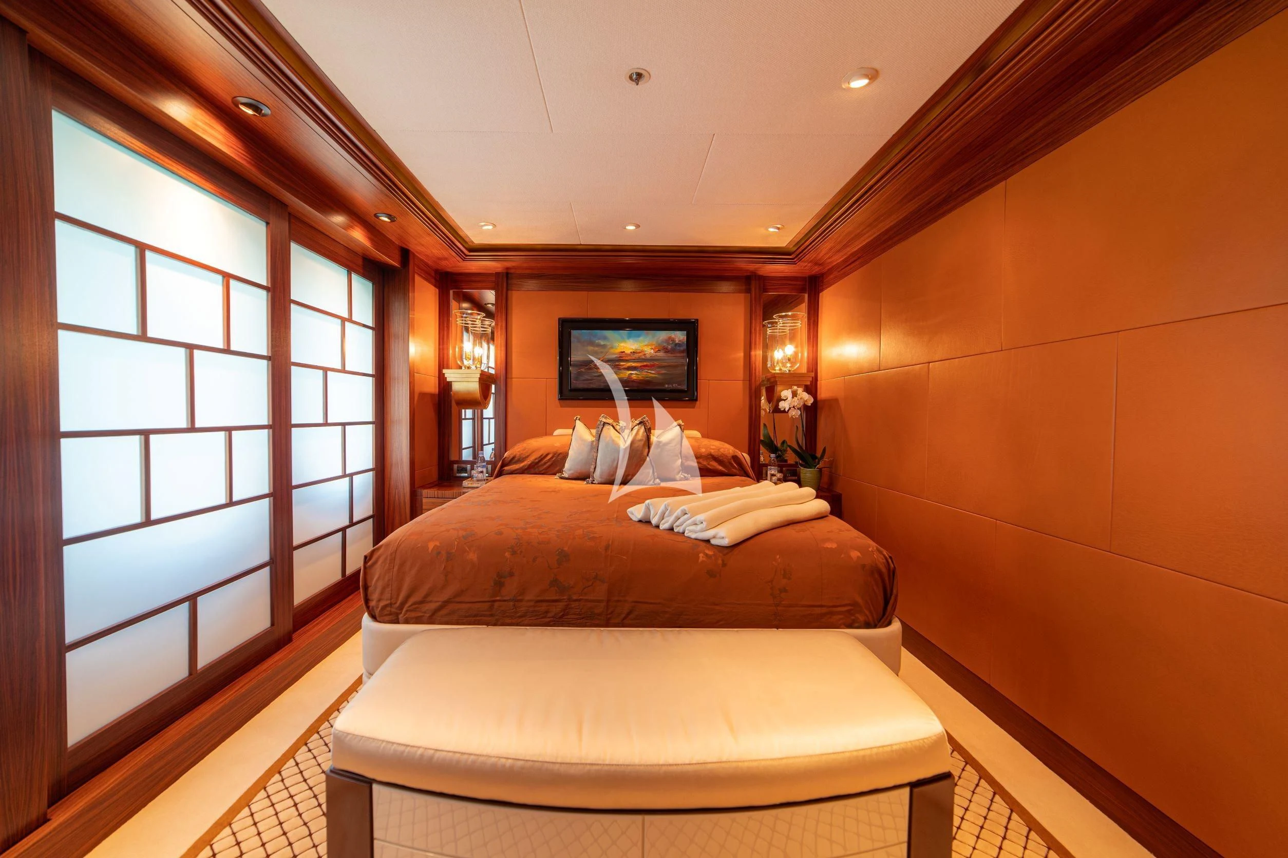 a bedroom with two beds aboard TRIDENT Yacht for Charter
