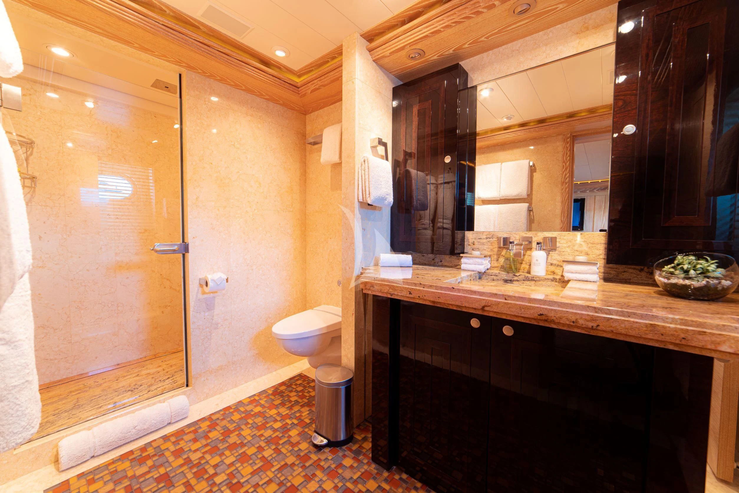 a bathroom with a large mirror aboard TRIDENT Yacht for Charter