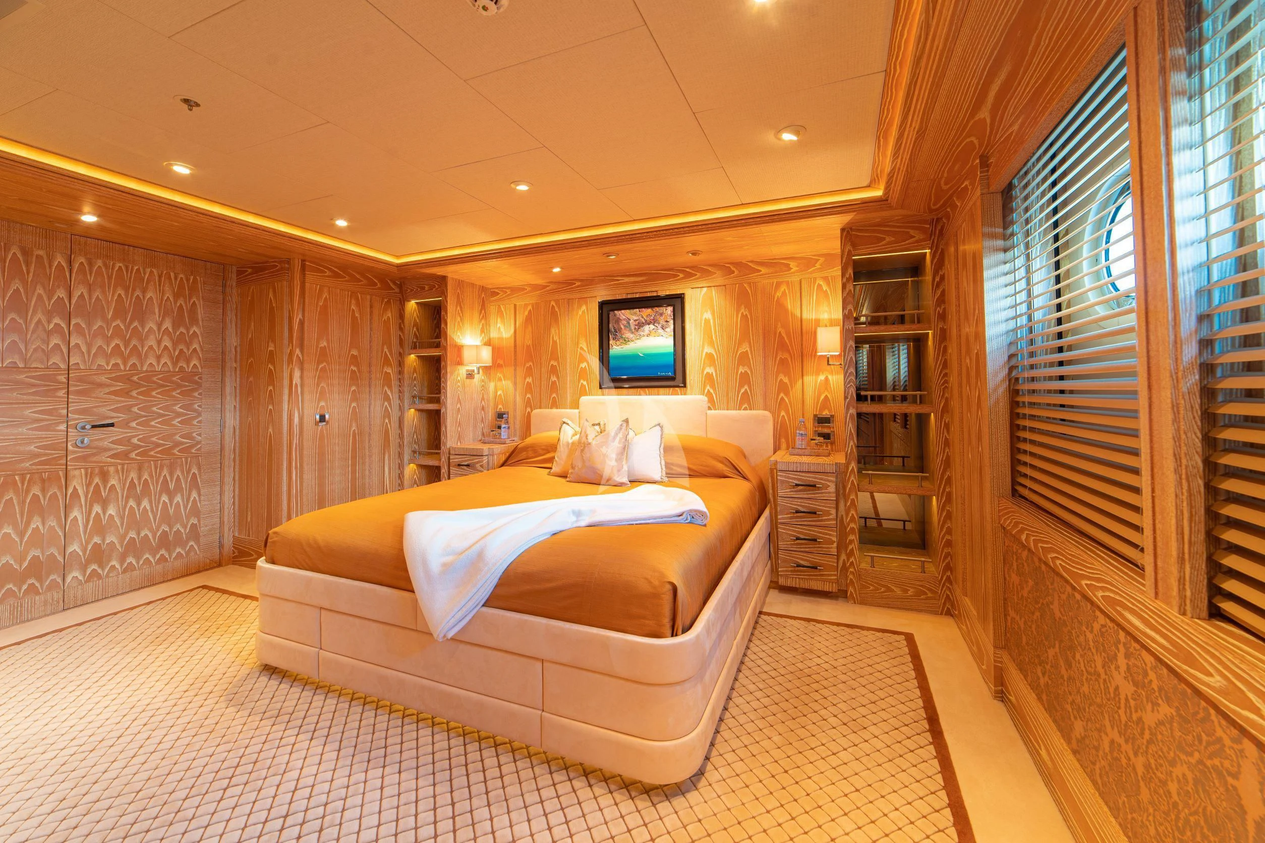 a large bedroom with a large bed aboard TRIDENT Yacht for Charter