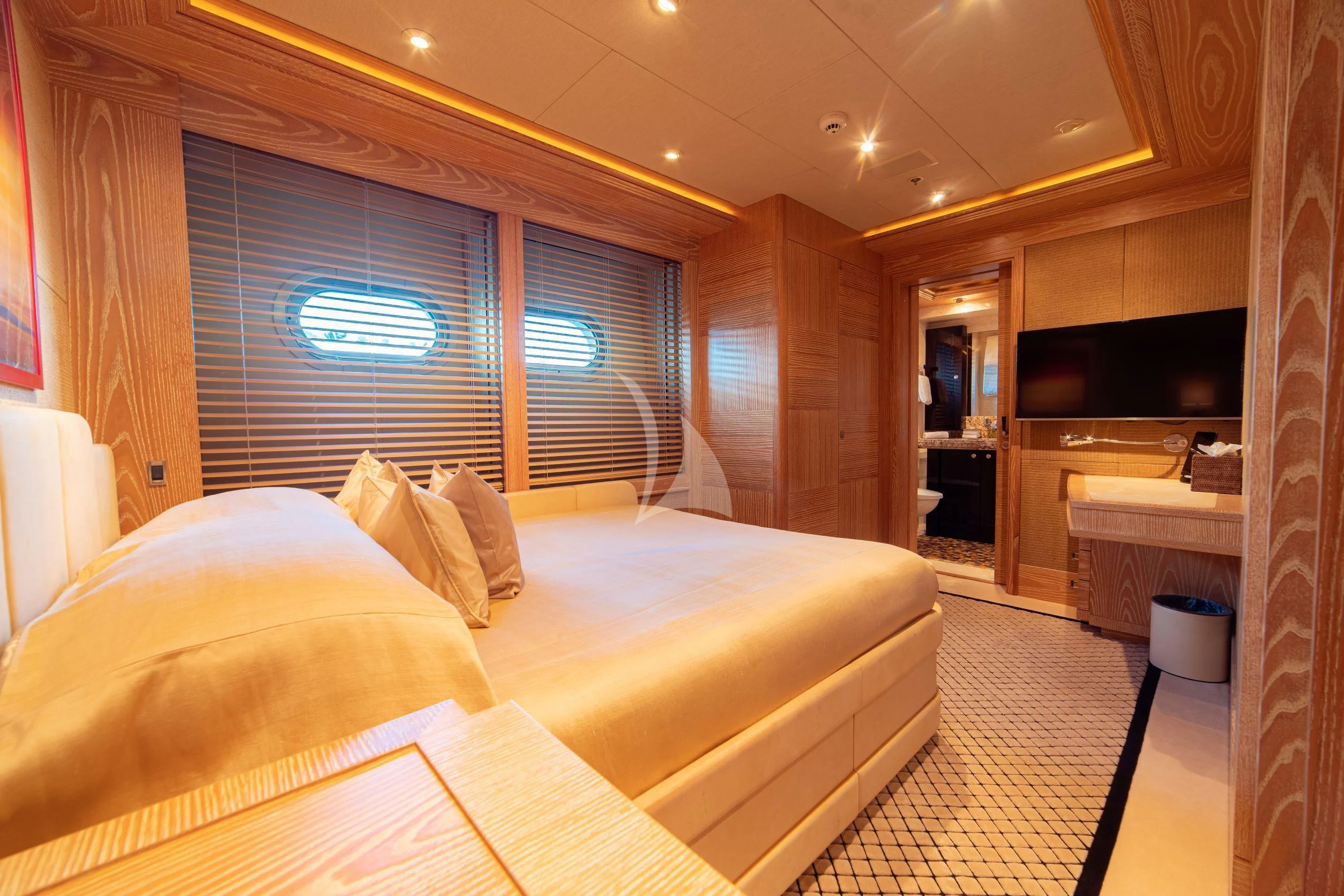 a room with a bed and a window aboard TRIDENT Yacht for Charter