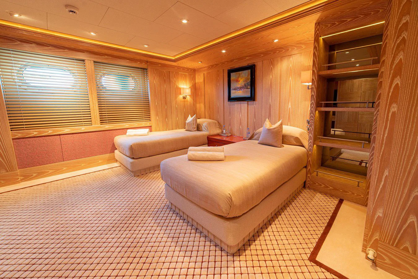 a room with a bed and a couch aboard TRIDENT Yacht for Charter