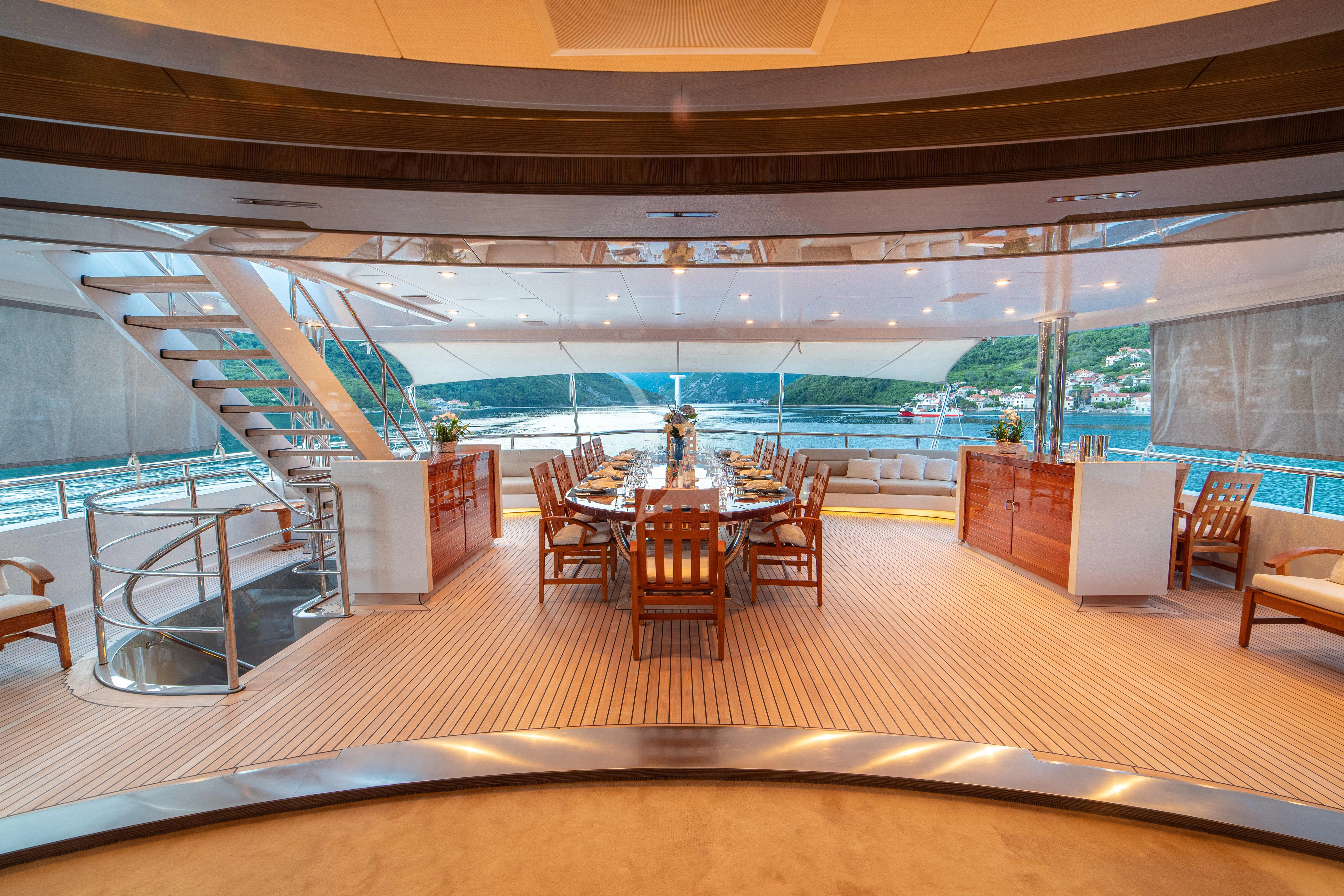 a room with a table and chairs aboard TRIDENT Yacht for Charter