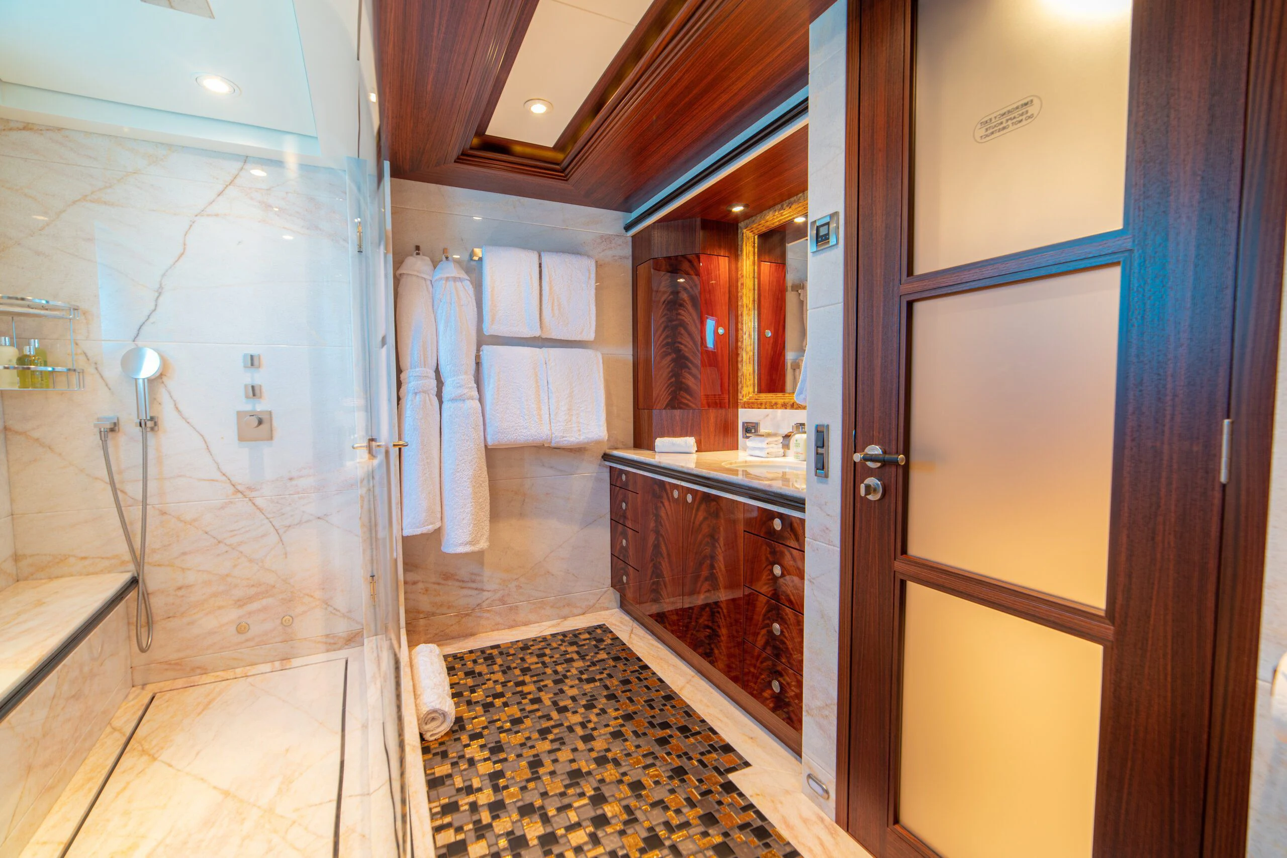 a bathroom with a shower and a sink aboard TRIDENT Yacht for Charter