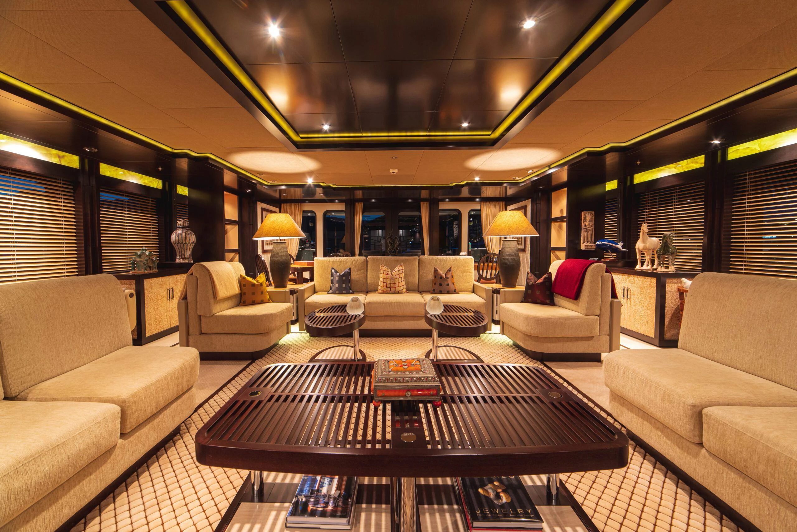 a living room with a large window aboard TRIDENT Yacht for Charter