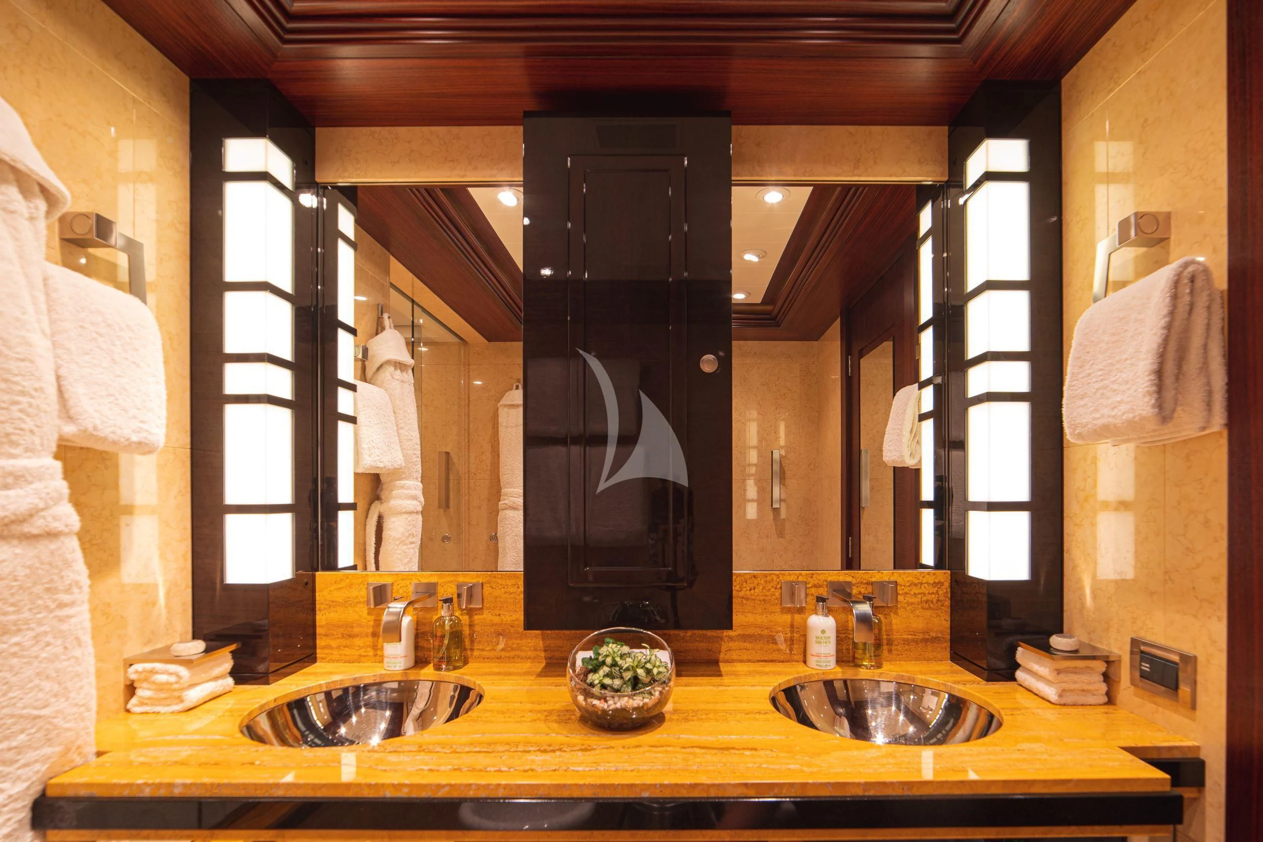 a bathroom with a large mirror aboard TRIDENT Yacht for Charter