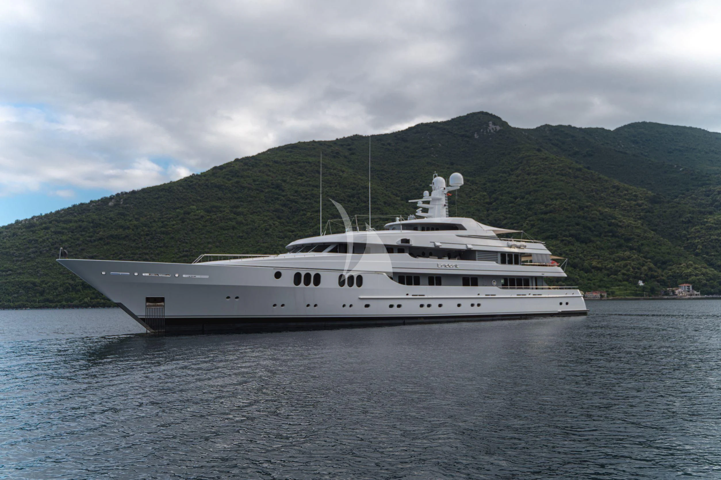 a white yacht in the water aboard TRIDENT Yacht for Charter
