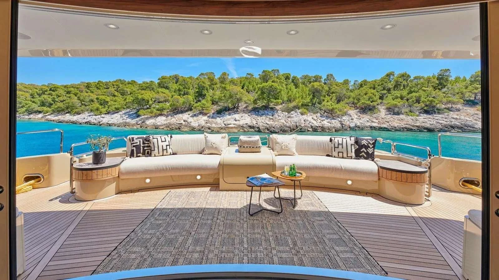 a patio with a table and chairs aboard PROMETHEUS I Yacht for Charter