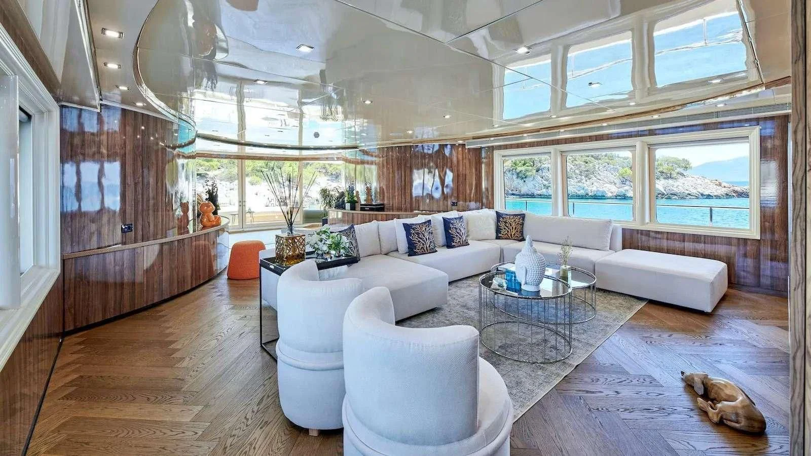 a living room with a large window aboard PROMETHEUS I Yacht for Charter