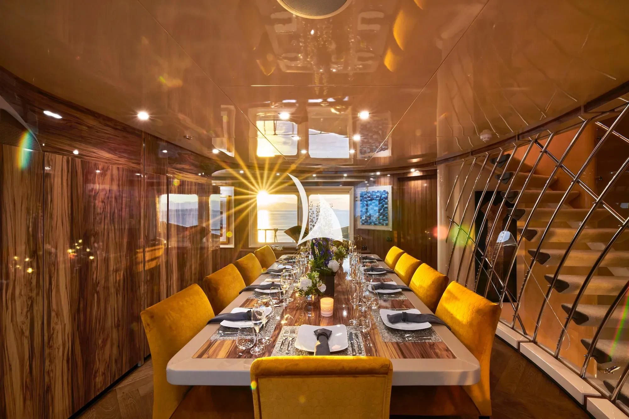 a room with a table and chairs aboard PROMETHEUS I Yacht for Charter
