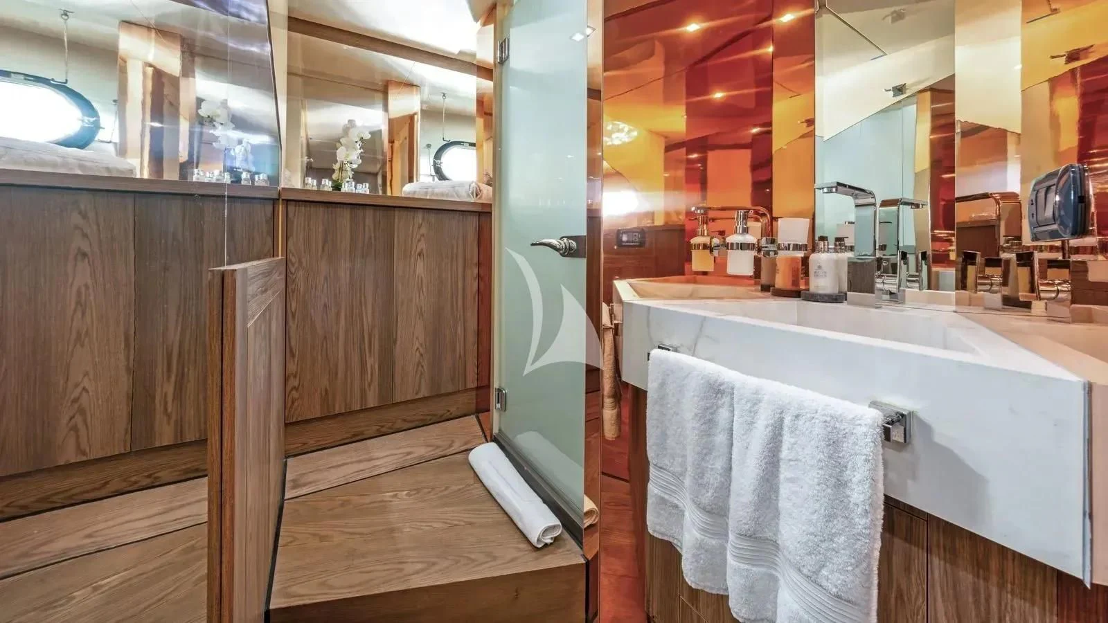 a bathroom with a bathtub and sink aboard PROMETHEUS I Yacht for Charter