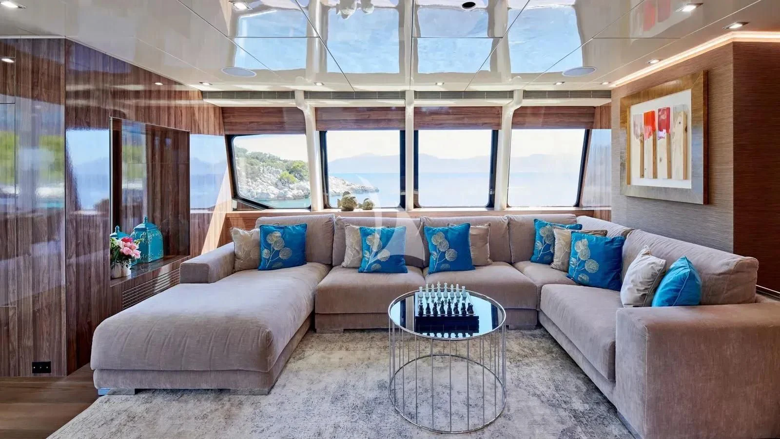 a living room with a couch and a table aboard PROMETHEUS I Yacht for Charter