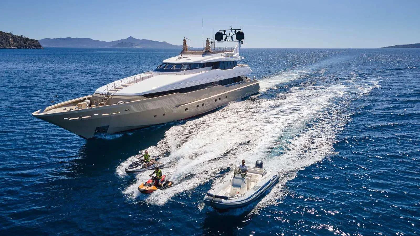 a boat carrying a boat aboard PROMETHEUS I Yacht for Charter