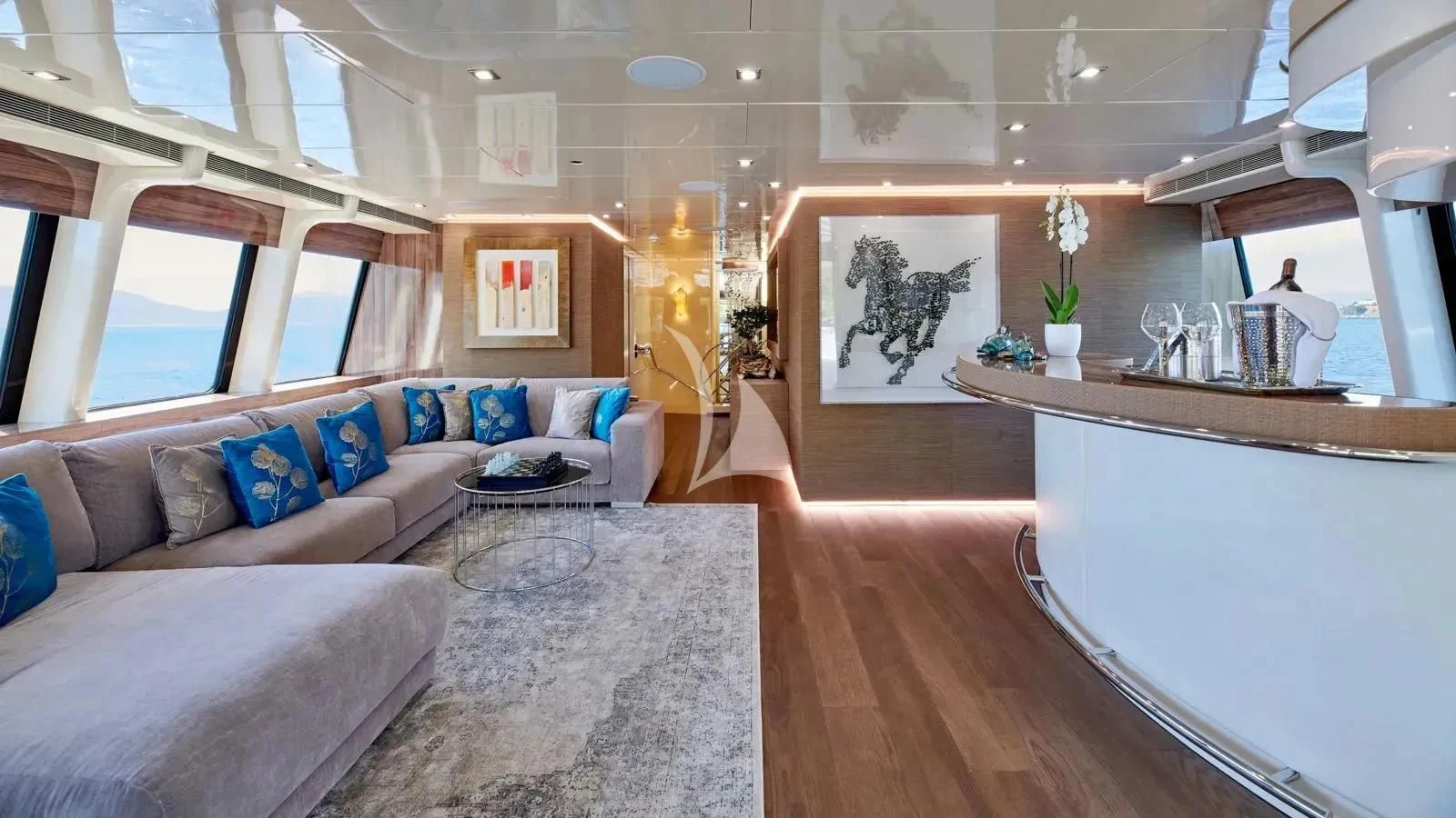 a living room with a couch and a table aboard PROMETHEUS I Yacht for Charter